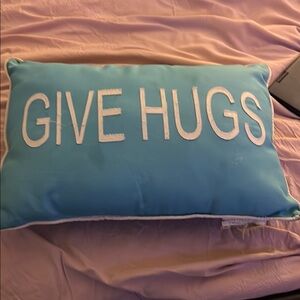 Blue Pillow with 'Give Hugs' Text